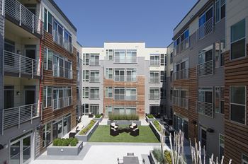 Building exterior and courtyard with grills
